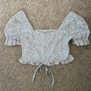 small white and black ruffle top with tie